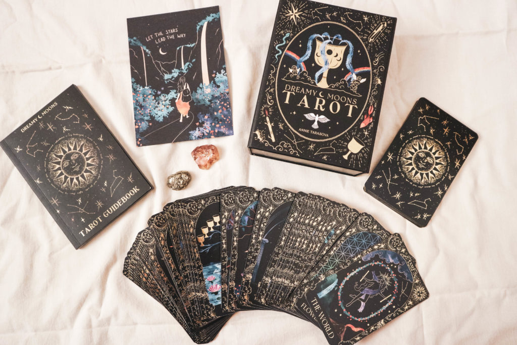A flatlay of the DreamyMoons Tarot Cards and box.