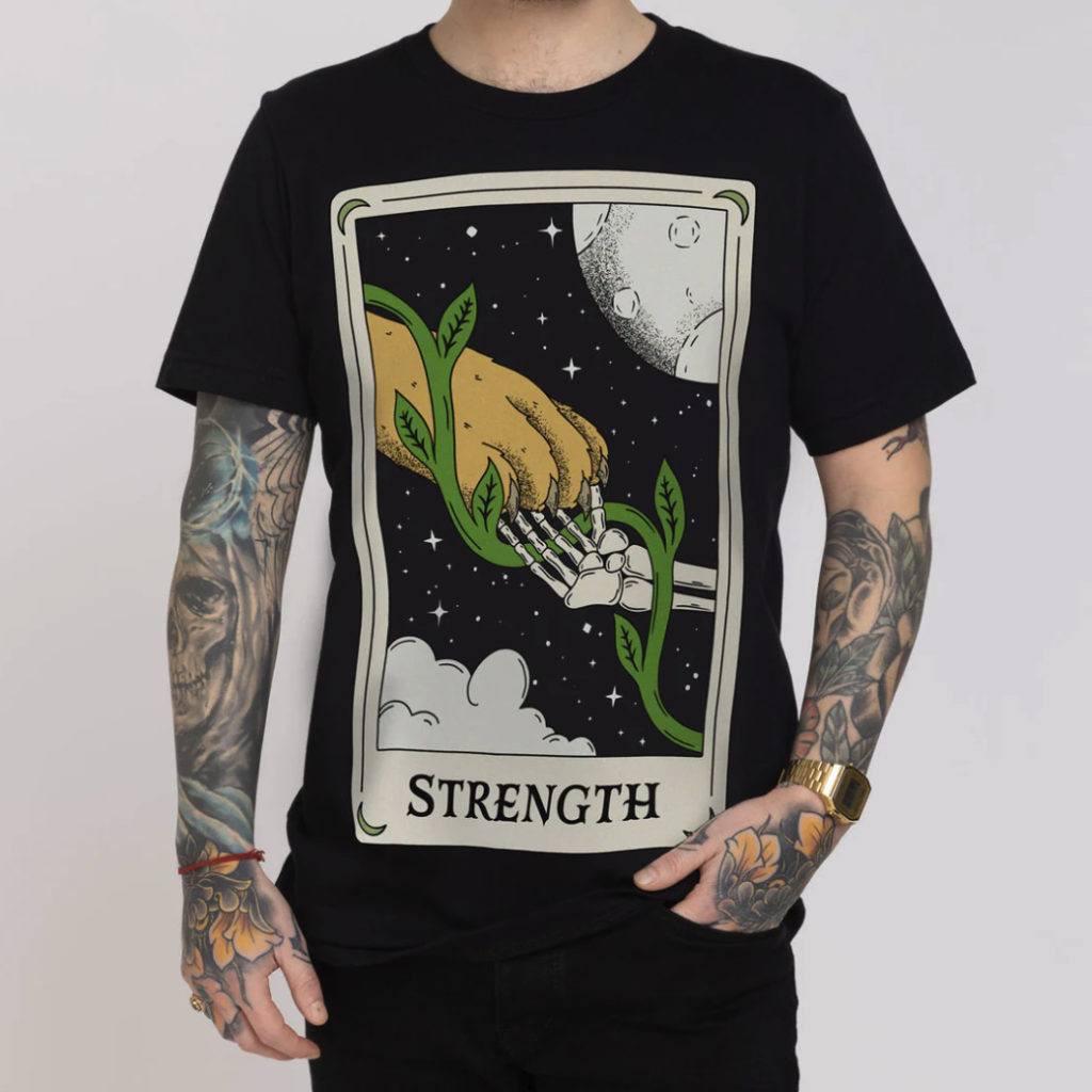 A black t-shirt with Strength Tarot Card design