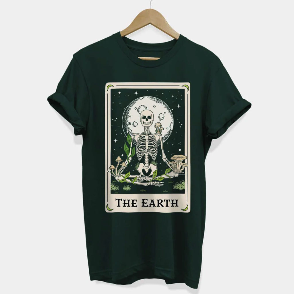 A green t-shirt with The Earth Tarot Card design