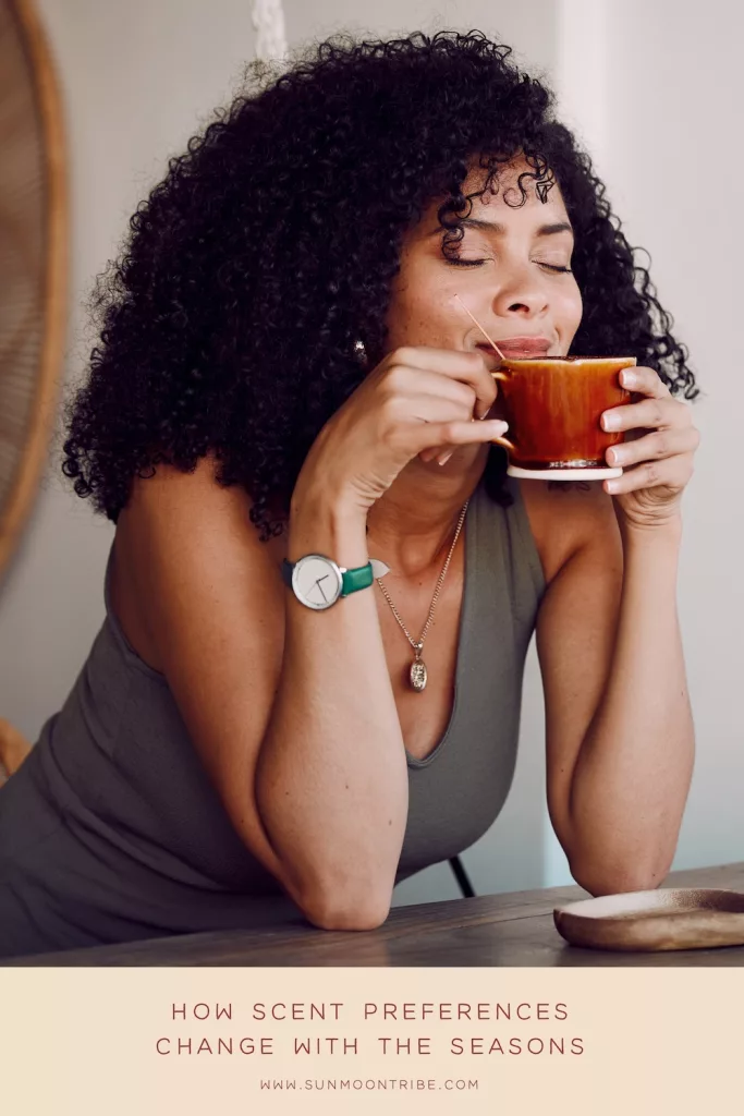 Woman enjoying the aroma from a hot cup of coffee.
